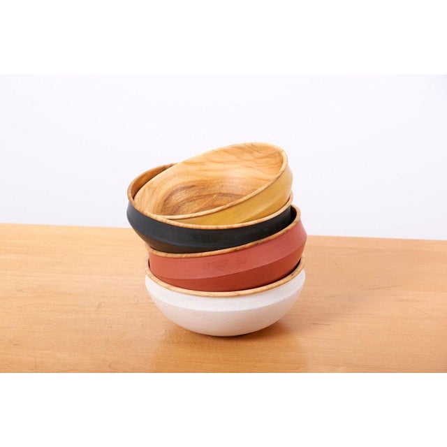 Set of 4 different colored handcrafted wooden bowls by Fabian Fischer, Germany, 2020. Made of beechwood with milk paint...