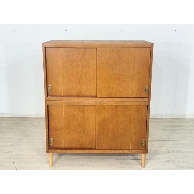 For sale is a stylish mid-century modern cabinet from the 1960s. This piece of furniture impresses with its clean lines,...