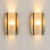 a pair of italian wall lamps from the late 1960s, crafted from natural onyx and opal glass. Each sconce features a curved...