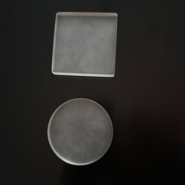 Chic acrylic tabletop tic tac toe board with alternating clear and frosted game pieces. Board 10in X 10in I/2in thick board