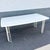A distinctive Mid-Century Modern rectangular dining table showcasing the era’s fascination with sculptural form and...