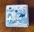 Chinoiserie 4" square porcelain lidded box. Hand-painted "Sansui" (mountain and water) landscape. The scene features a...