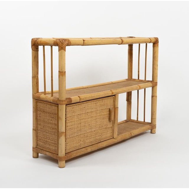 Midcentury beautiful cabinet storage or sideboard in bamboo and rattan composed of one drawers and three shelves in the...