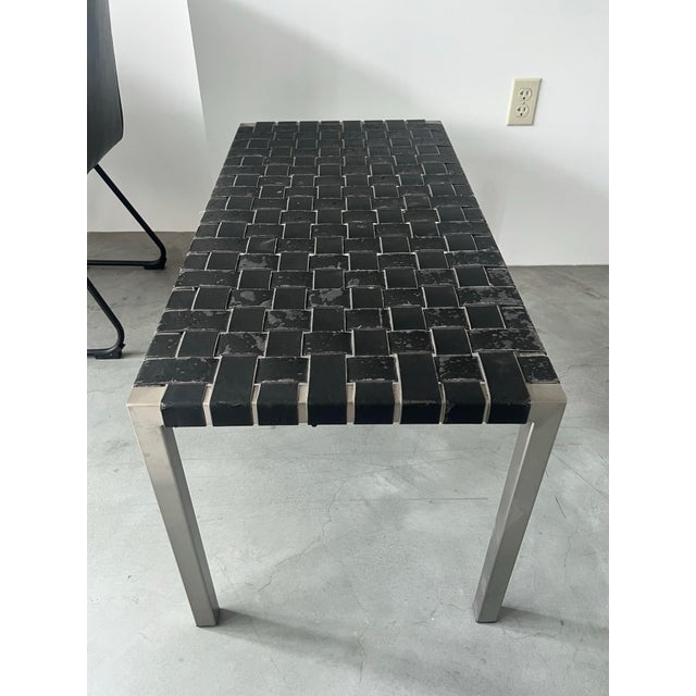 Steel frame bench with black leather strapping. This bench is similar to pieces by designers Douglas Kelly, Ross Littell,...