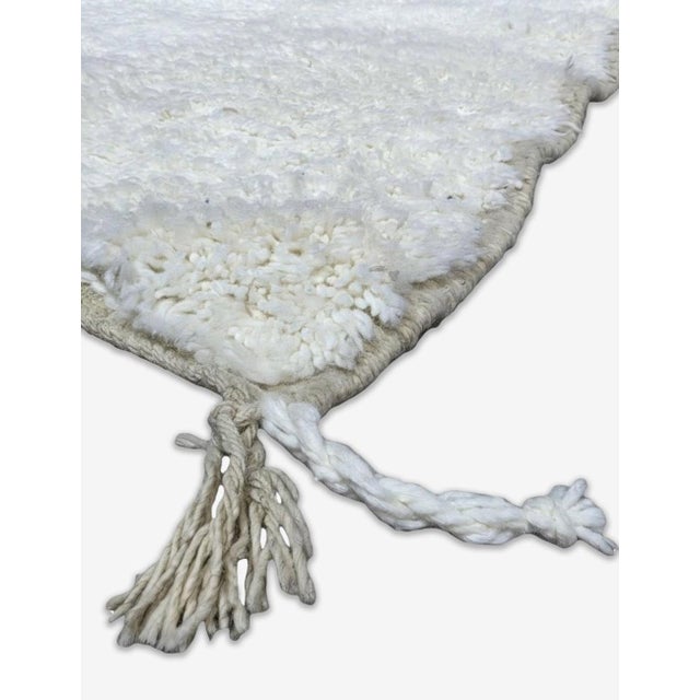 Boujad Rug | Handwoven Berber Wool Rug in Solid Undyed Ivory This beautifully pure Boujad rug features an entirely solid,...