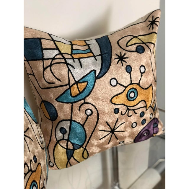 Fabulous pair of Miro inspired contemporary tapestry pillows in hues of blush, turquoise, orange, and purple. The tapestry...