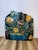 A spectacular one-of-a-kind vintage fireplace screen featuring an exuberant arrangement of dimensional flowers and foliage...