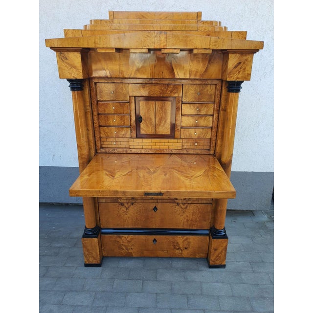 Typical Berlin Biedermeier secretary desk, with pedestal and drawer, Schinkel roof, calf teeth, and below it a beautifully...