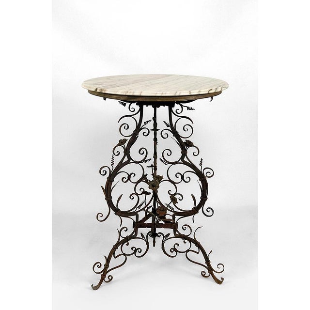 Venice, Italy, 17th-18th century Old wrought iron tripod base of a basin or a brazier with floral decorations from the...