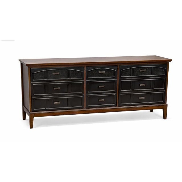 Description: Classic American mid-century design from Dixie Furniture Company. This nine-drawer lowboy blends warm walnut...