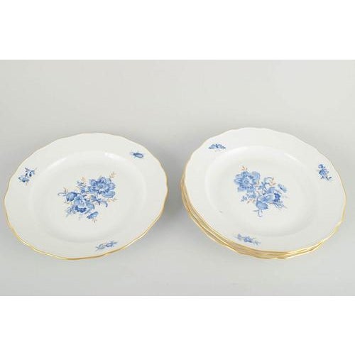 Meissen 4 dinner plates, early 20th century. Hand-decorated porcelain with hand-painted blue floral motifs and gilt...