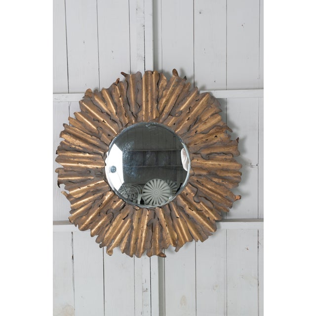 A handcrafted, torch cut brass stylized sunburst mirror. Brutalist in style. Constructed of individual distressed and...