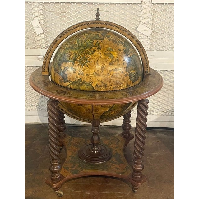 The Vintage Italian Terrestrial Globe on Stand is a charming and historical piece that adds a touch of nostalgia to any...