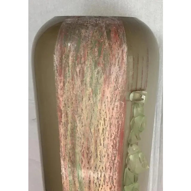 This monumental Art Deco floor vase by Anatole Riecke stands as a testament to the era's grandeur. Crafted from...