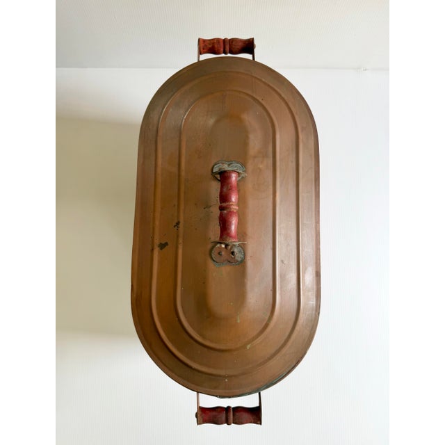 Antique solid copper tub. Has been used to heat water over a fire, judging by the blackened bottom. A stunning piece for...