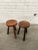 A charming pair of European stools. Slightly tapered legs with faceted live-edge seats showcasing the wood grain....