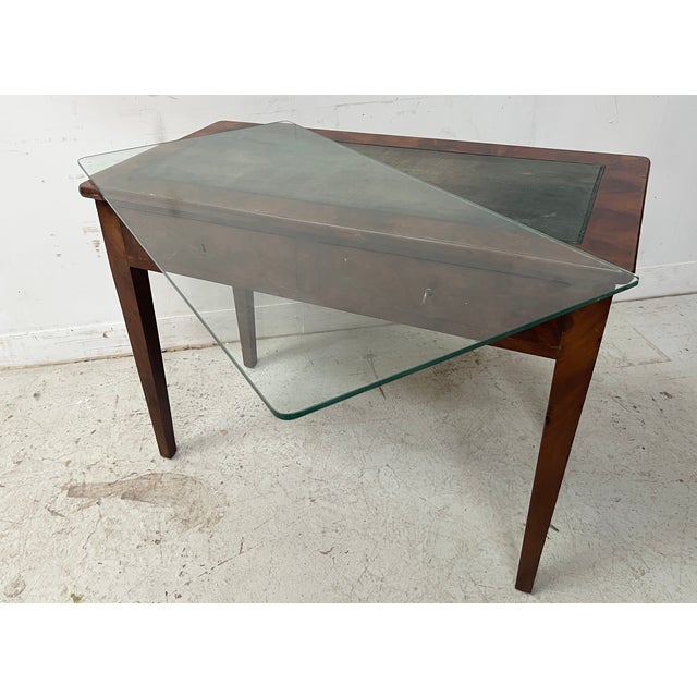 Directoire-style flat desk in mahogany and oak veneer Four tapered legs Two drawers in the front Used green leather top...