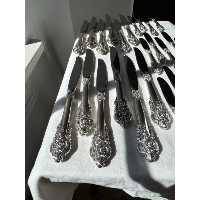 A stunning set of authentic Wallace Grande Baroque sterling silver flatware knives, featuring richly detailed sterling...