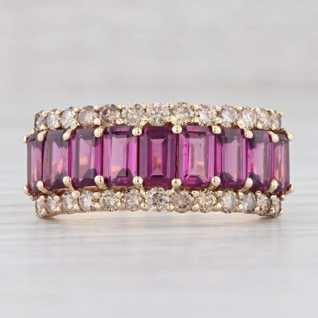 Gemstone Information: - Natural Garnets - Total Carats - 3.60ctw Cut - Emerald Color - Dark Red - Natural Diamonds - Total...