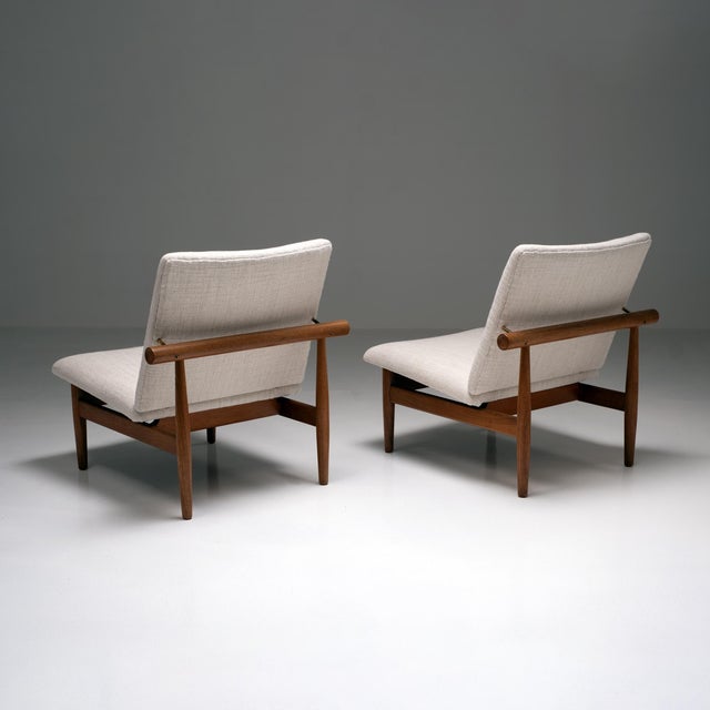An exceptional pair of Model FD 137/1 ‘Japan’ lounge chairs by Finn Juhl, produced by France & Søn. A refined embodiment...