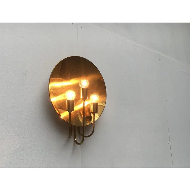 Impressive wall light from luminaire designer Florian Schulz. The design impresses with its simple elegance and high-...