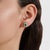 This elegant pair of emerald stud earrings is crafted in 925 sterling silver, featuring 0.88 carats of octagon-cut...