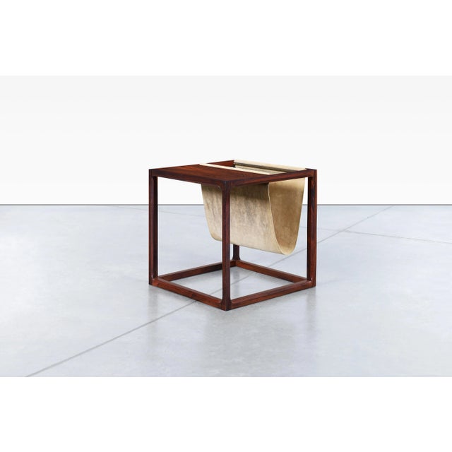 Danish modern Brazilian rosewood magazine rack designed by Kai Kristiansen for Aksel Kjersgaard in Denmark, circa 1960s....