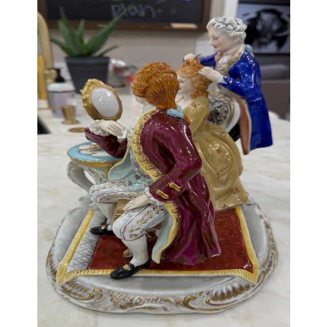 Elegant mid-century Karl Ens hand-painted porcelain figurine depicting a refined 18th-century Rococo salon scene. A lady...