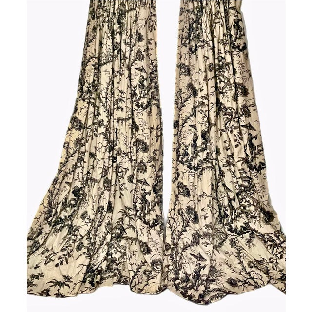 Scalamandré custom linen pinch pleated Chinoiserie toile curtains in a warm parchment tone with black design including...