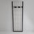 Wall-mounted coat rack with a white painted wooden grid structure, black painted wooden hooks, and a black painted metal...
