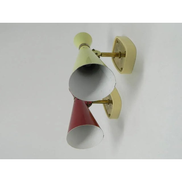 This beautiful couple of wall lights was produced by Rupert Nikoll in Vienna in the 1960s. They are made of painted sheet...