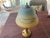 Here is a really fun reverse painted shade with original gold leaf base. While there is a chip on the bottom of the lamp,...