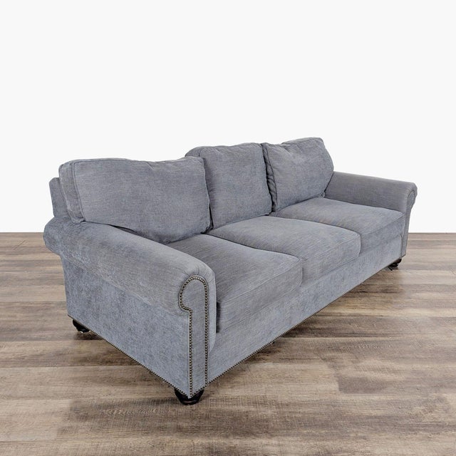 Features fabric upholstery, rolled arms and nailhead trim. Brand: Pottery Barn. Dimensions (in): 92W x 42D x 33H.