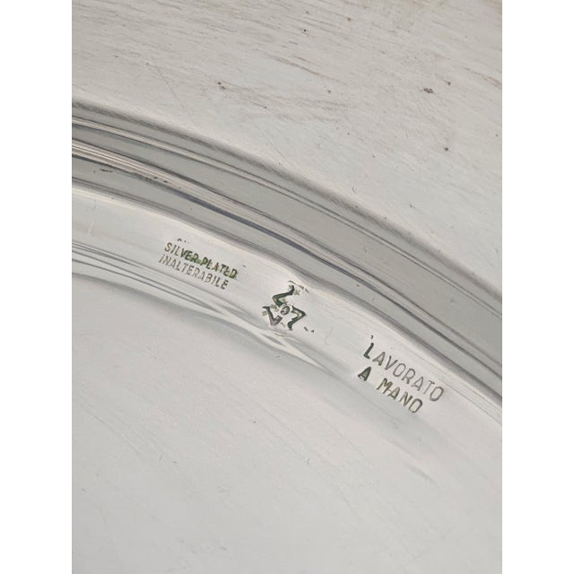 Circular antipasto tray, an elegant serving tray typically used for serving different snacks, appetizers, or dips...