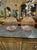The product is a pair of large scale pink Murano globe lamps. These elegant and vibrant lamps are perfect for adding a...