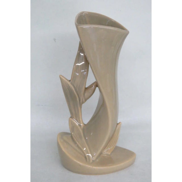 This gorgeous Vase is made out of ceramic. This vase is signed as being made by Roseville in the United States with the...