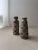 Two vases that are clearly related, yet each possesses its own distinct character. These ceramic vases were produced by...
