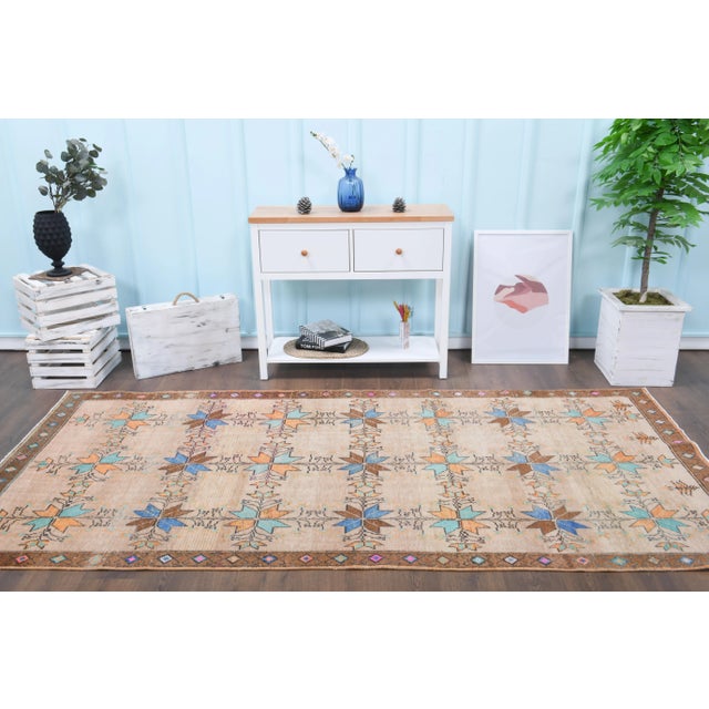 Vintage Turkish Hand-Knotted vintage rug is a semi-Vintage arae rug.'70s Eastern region of Turkey's unique rug is...