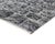 A dense, distressed charcoal field flecked with silver gray, its fine horizontal banding giving the surface a weathered,...