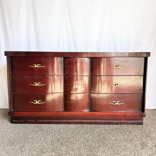 This elegant Art Deco dresser showcases the timeless craftsmanship and bold geometry that defined early 20th-century...