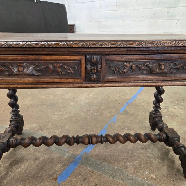 This Jacobean Carved Oak Barley Twist H-Stretcher and Leg Writing Table is a beautiful accent piece for the home or office...