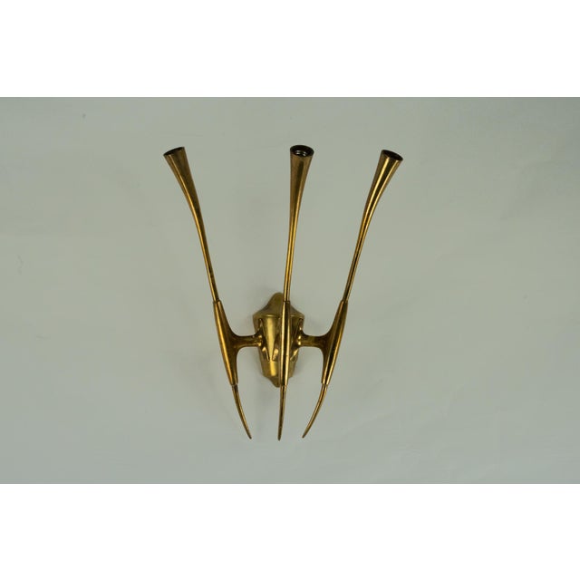 Brass wall sconce designed by Oscar Torlasco for Lumi Milano, crafted in the 1950s. This exquisite mid-century modern...