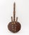 Two West African Musical Instruments, comprising: hide wrapped wood kora with gourd body and cowry shell accents and bow...
