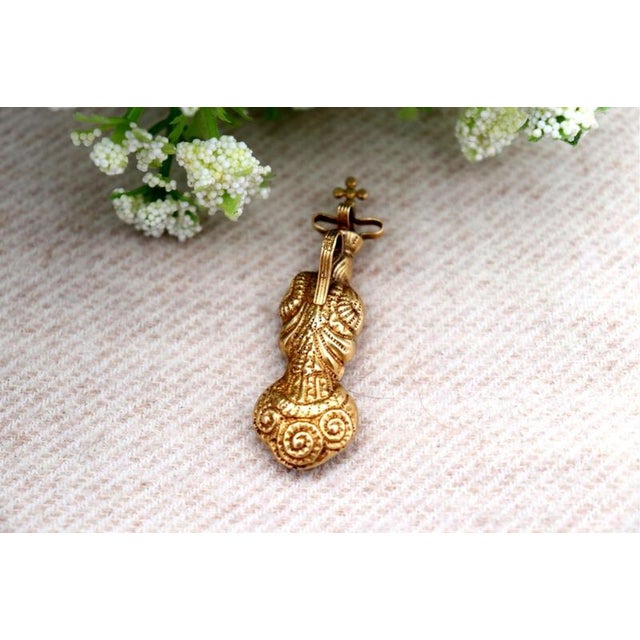 19.2K Gold Our Lady of the Immaculate Conception Pendant, in Worn conditions.