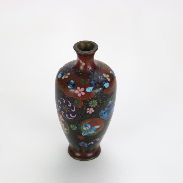 Antique Cloisonne Enameled Cabinet Vase with Garden Flowers, Early 20thC. 4 7/8" x 2 1/4" x 2 1/4". A beautifully crafted...