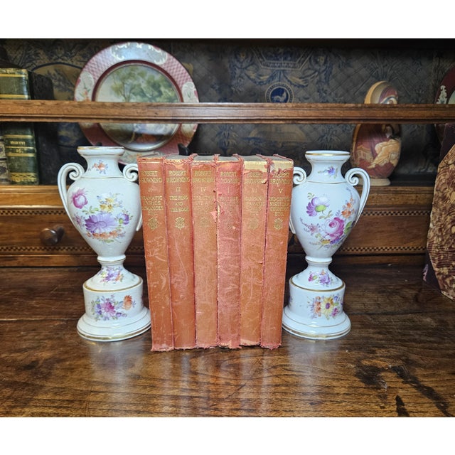 This charming pair of Bavarian porcelain urns, marked “Dresden G X S” on the bottom, was created by B. Grossbaum & Söhne,...