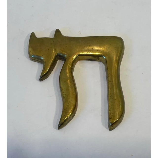 Nice solid brass paperweight in the form of Hebrew word Hai Chai which means life.