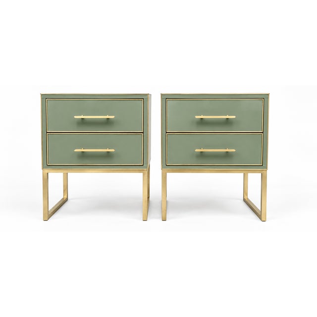 Sage green Murano glass and polished brass bring a quiet, architectural character to this pair of Italian bedside tables...
