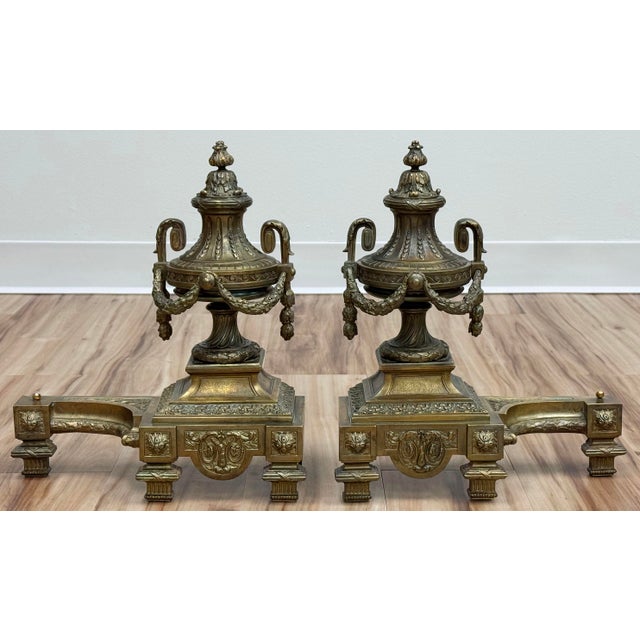 Wonderful vintage set of French gilt bronze chenets andirons with exquisite Neo-Classical styling. Feature incredible...