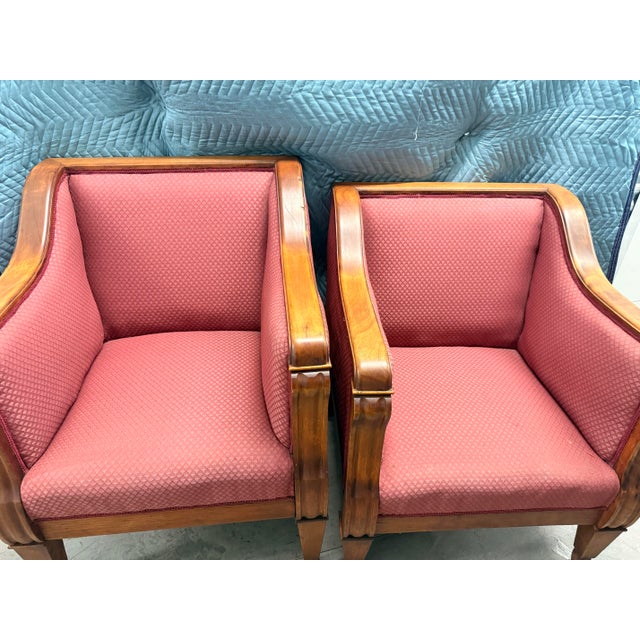 A gorgeous pair of vintage Biedermeier revival club chairs featuring elegant polished cherry wood frames and an...